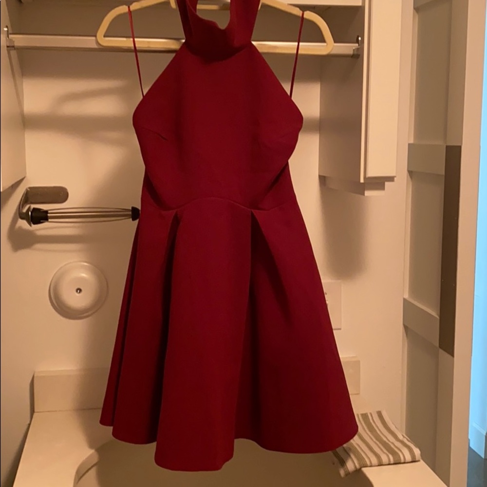 Maroon backless turtleneck dress.